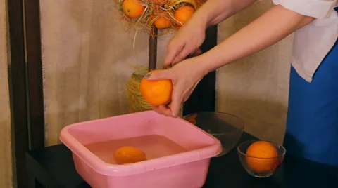 Girl, masseuse cut oranges Stock-Footage 49319341