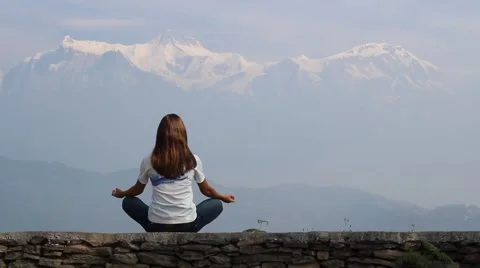 Girl meditating on the background of Annapurna Stock Footage 59134213
