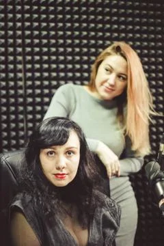 The girl at the microphone in the Studio Stock Photos