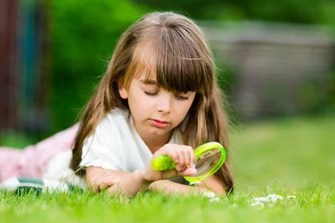Girl with microscope Stock Photos
