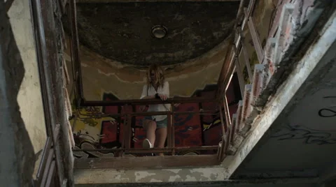 Girl model posing on camera walking through the ruins of an abandoned building. Stock Footage 60989922