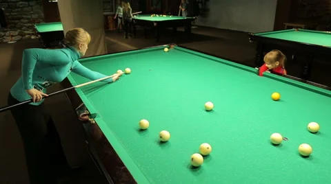 Girl with mom  plays billiards Stock Footage 44754792