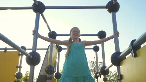 Girl on a monkey bars Stock Footage 134079190