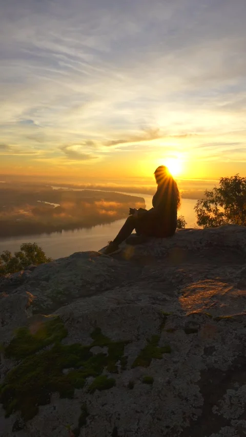 Girl on Mountain With Beautiful Dramatic Sunset Autumn Fall Foliage Stock Footage 256052595