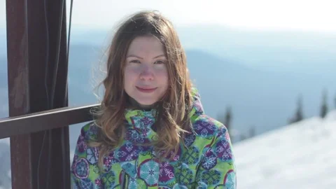 Girl in mountains smiling at camera 스톡 동영상 73287014