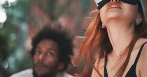 A girl moving her hand while using vr glasses Stock Footage 201673552