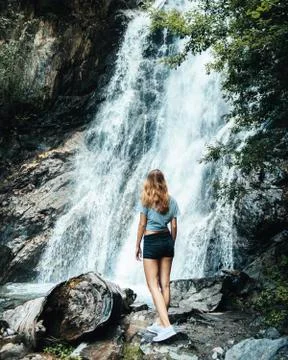 Girl at natural waterfall, Austria Stock Photos