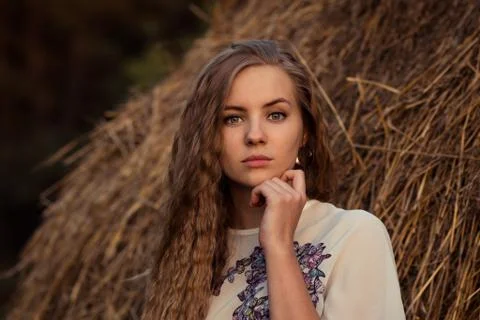 Girl near the hay Stock Photos