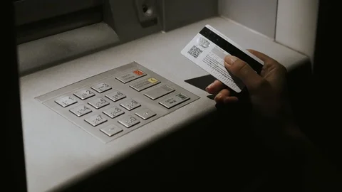 Girl at night enters pin code in ATM Vídeo Stock 110794631