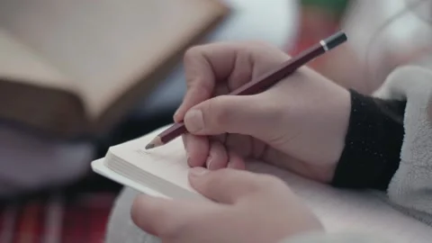 Girl note something with pencil Video stock 138645454