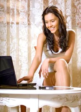 Girl with notebook computer Stock Photos