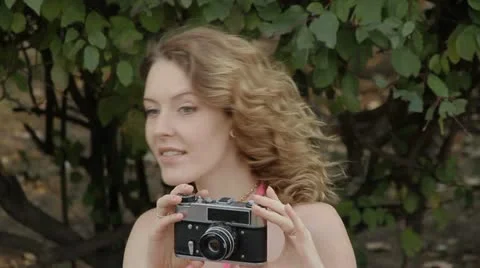 Girl with an old camera Stock Footage 12224269