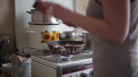 The girl in only t-shirt cooking in the kitchen Video stock 59798358