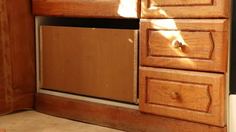 Girl opening a broken kitchen drawer in the kitchen Stock Footage 264998117