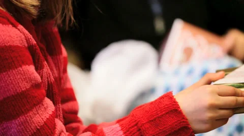Girl opening a Christmas present Stock Footage 34335019