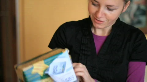 Girl opening present Stock Footage 744574