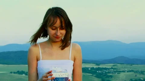 The girl opens a gift Video stock 52721733