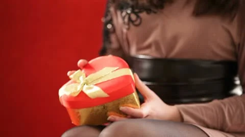 Girl opens the gift. HD Stock Footage 10574487