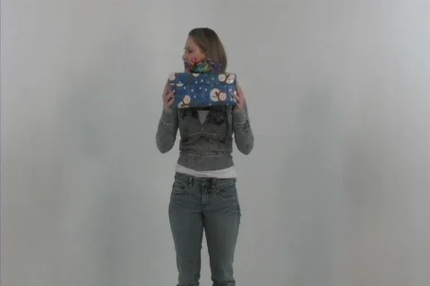 Girl opens happy present Stock-Footage 106602