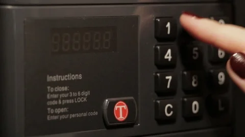 The girl opens a reliable electronic safe. Stock Footage 88120962