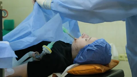 A girl on the operating table under anesthesia. Stock Footage 264757533