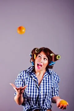 Girl with oranges Stock Photos