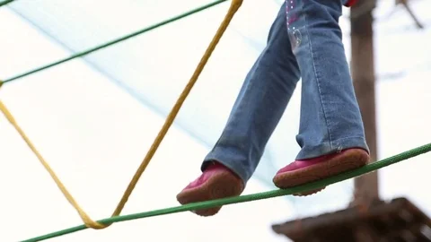 Girl overcomes a challenging obstacle Stock Footage 76776261