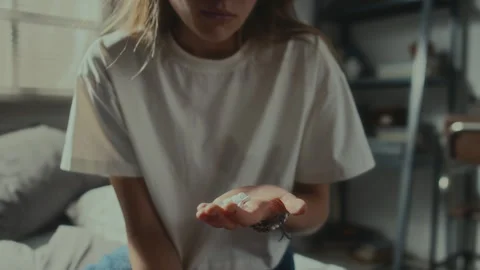 Girl Overdosing with Pills to Commit Suicide at Home Stock Footage 253282194