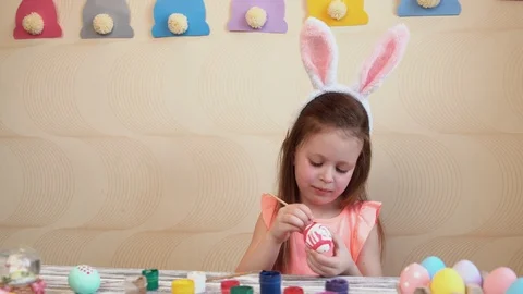 Girl paints the Easter eggs Stock Footage 88638231