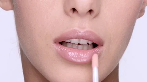 Girl paints her lips using pencil cosmetic 스톡 동영상 64269760
