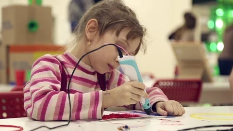The girl paints using 3D pen Stock Footage 71624067