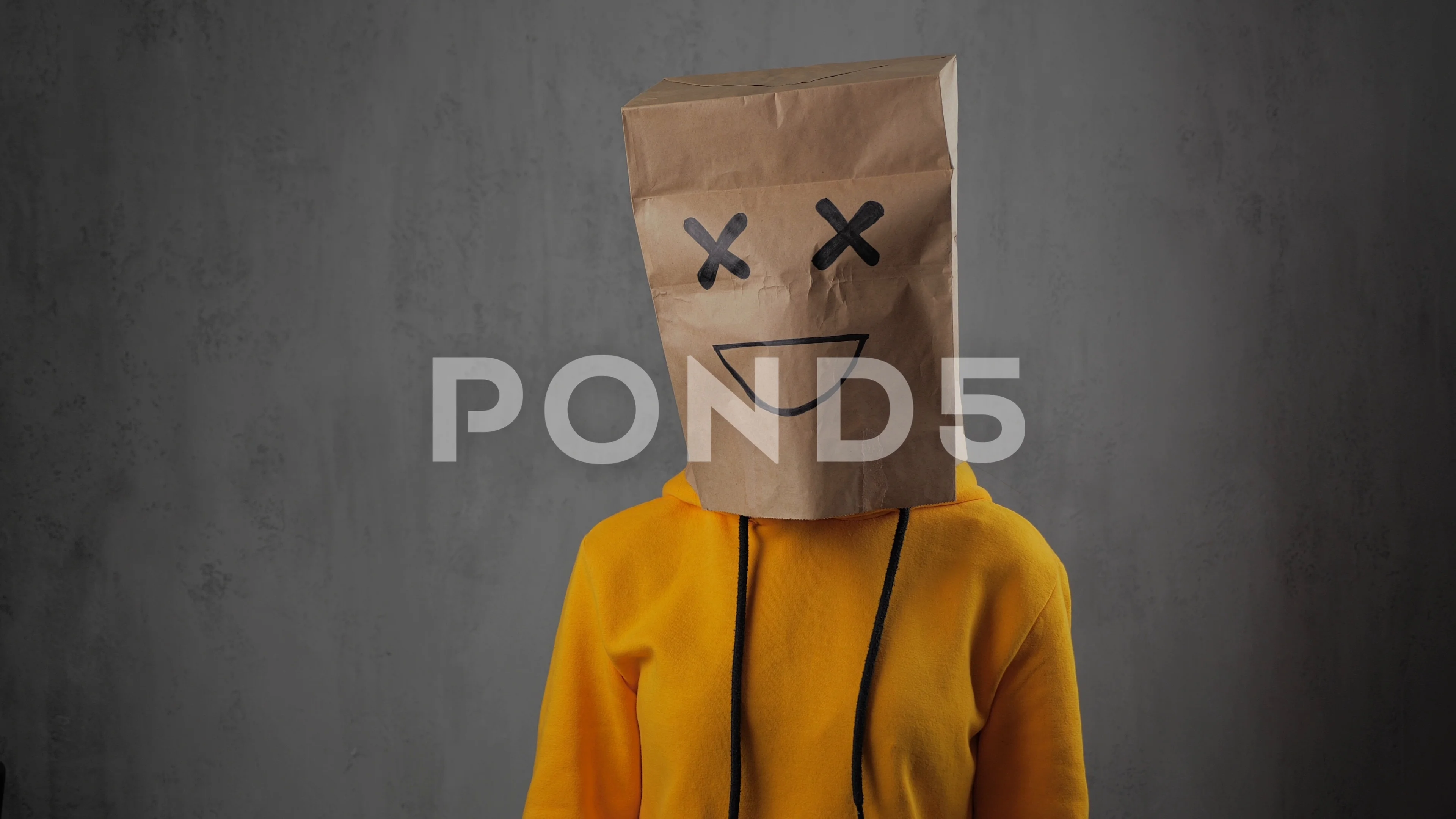 Sequel George Eliot Retired a girl with paper bags on his head, with... | Stock Video | Pond5