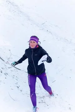 The girl participates in winter orienteering training in urban conditions. Fotos Stock