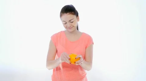 Girl Peeling an Orange Stock Footage 59132266