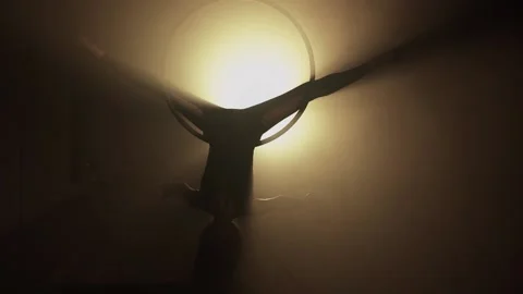Girl performs the acrobatic elements in the air ring. Black background Stock Footage 233453604