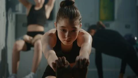 Girl Performs Deep Forward Bend Stretch in Warm Up Session, Improving Hamstring Stock Photos