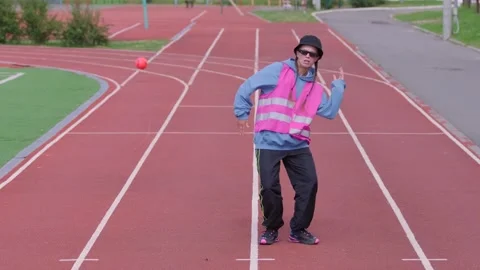 Girl performs spectacular elements of modern youth dance in a stadium Stock Footage 139458236