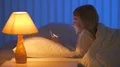 The girl phone on the bed. Evening night time 4k or 4k+ Resolution