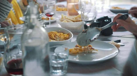 Girl picking up pasta Stock Footage 62985174