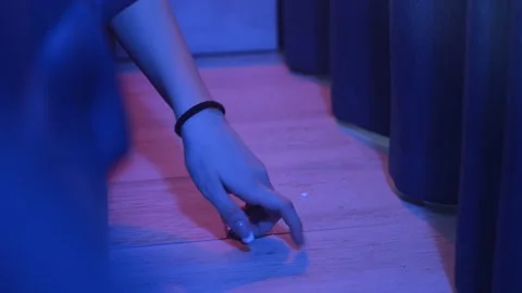 Girl picks up pills from the floor. Stock Footage 166399016