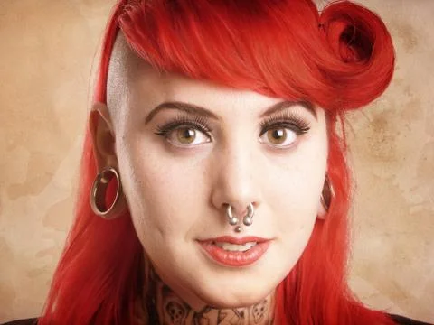Girl with piercings and tattoos Stock Photos