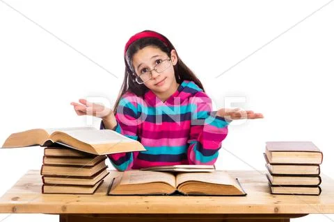 Girl with pile of old books showing ignorance Stock Photos