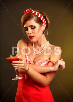 Girl in pin-up style drink martini cocktail . Stock Photos