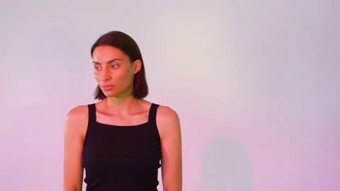 Girl on a pink background posing Stock Footage 146295410