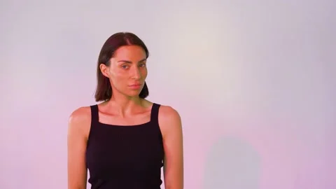 Girl on a pink background posing Video stock 146295518