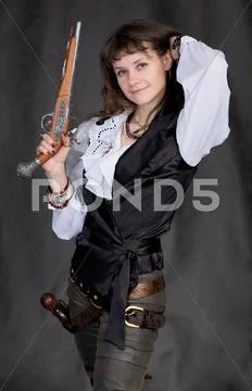 Girl - pirate with two pistols Stock Photos