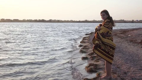 Girl in plaid by sea Stock Footage