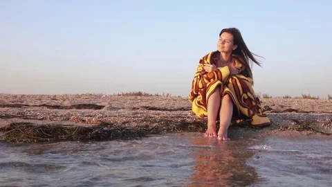 Girl in plaid by sea Stock Footage