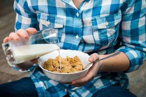 Girl with a plate of cereals Stock Photos