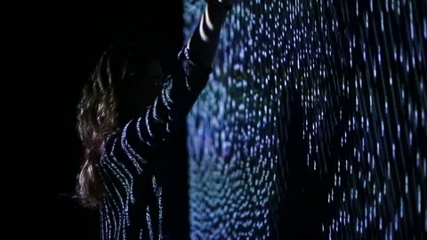 Girl play with interactive video installation Stock Footage 71435653